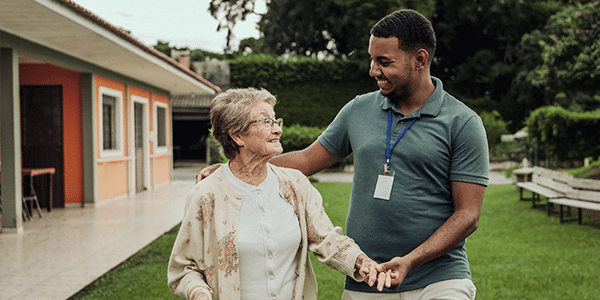 man helping an older woman
