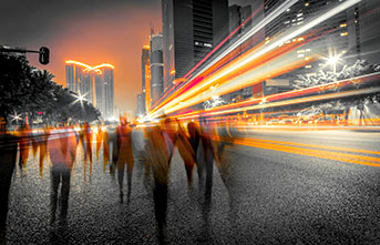 people-walking-in-city-at-night-with-orange-lights