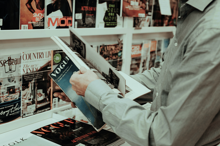 peron's hands holding magazine