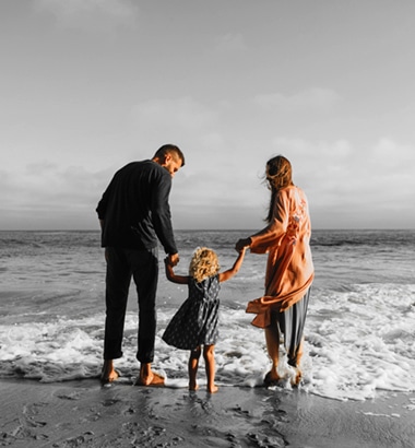 Man-and-Woman-with-child-on-beach