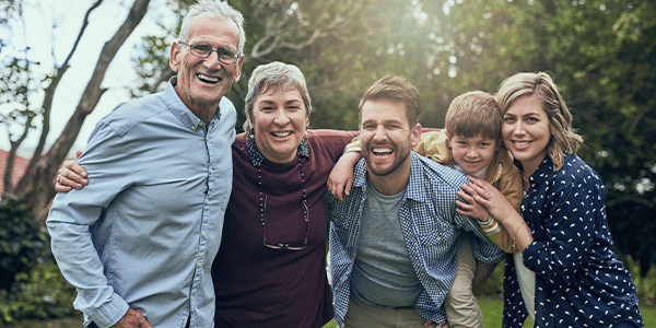 multi-generational family hugging