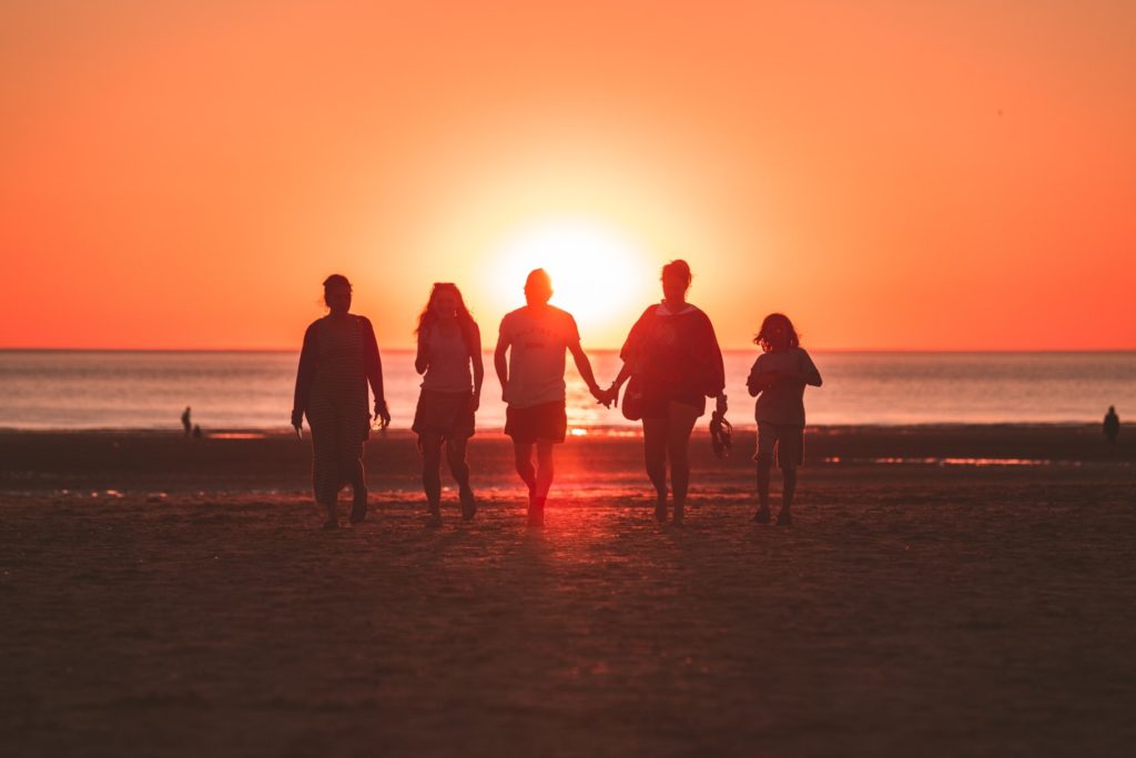 people walking on beach