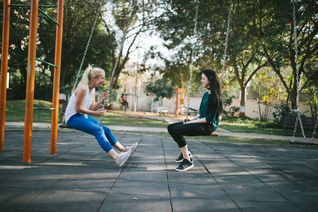 two young women on swings