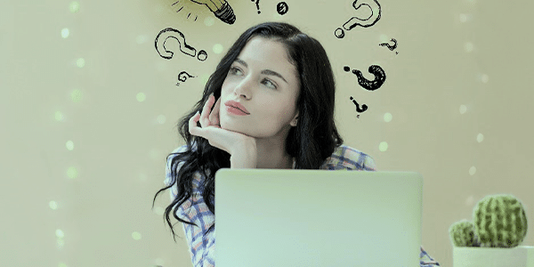 woman sitting in front of laptop