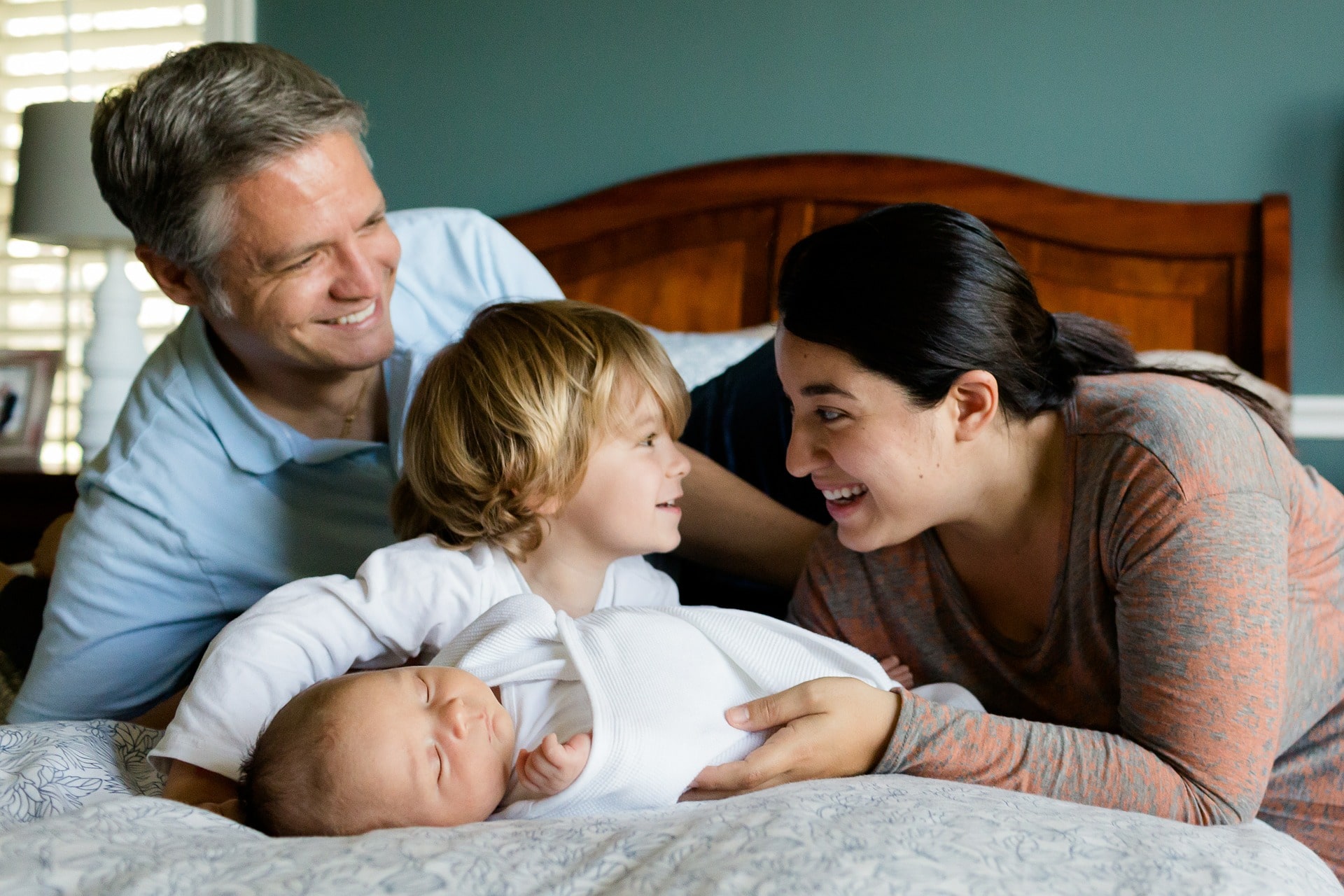 family on bed